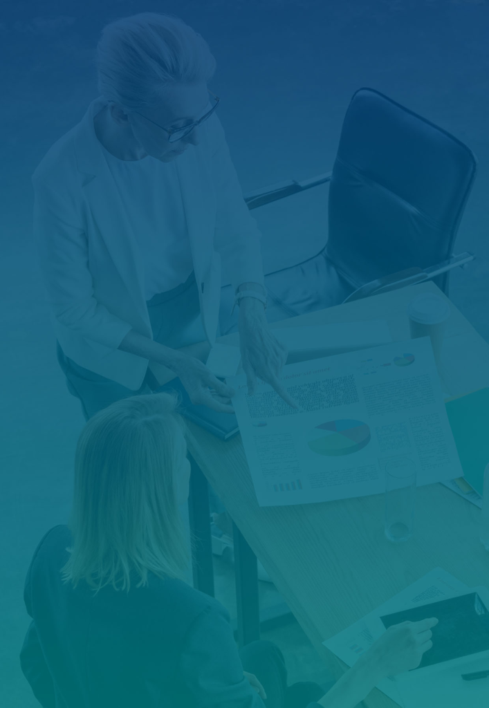 Two woman looking at charts trying to decide why growth/profits are stalled.